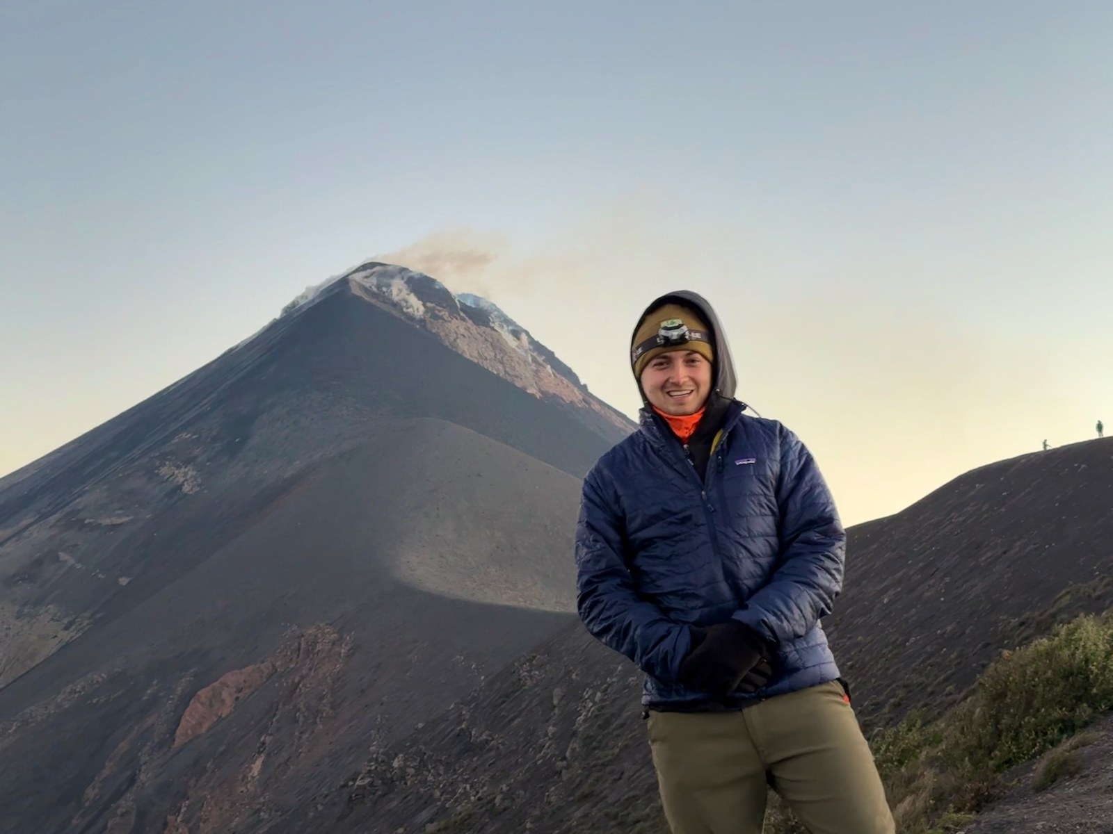 Brady in front of Volcán de Fuego at dawn, by Brady Noah